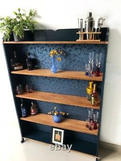 Solid oak and dark blue bookcase/display shelving unit
